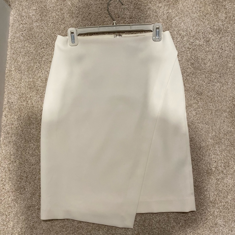 White asymmetrical skirt by White House Black Market.  Size 2.  EUC.